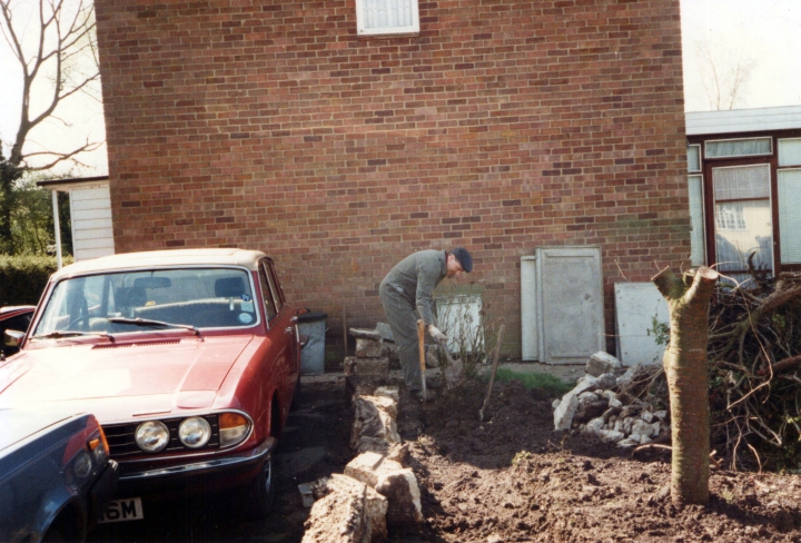 Tony working on foundations for the extension at Fullers. Note the red Triumph!